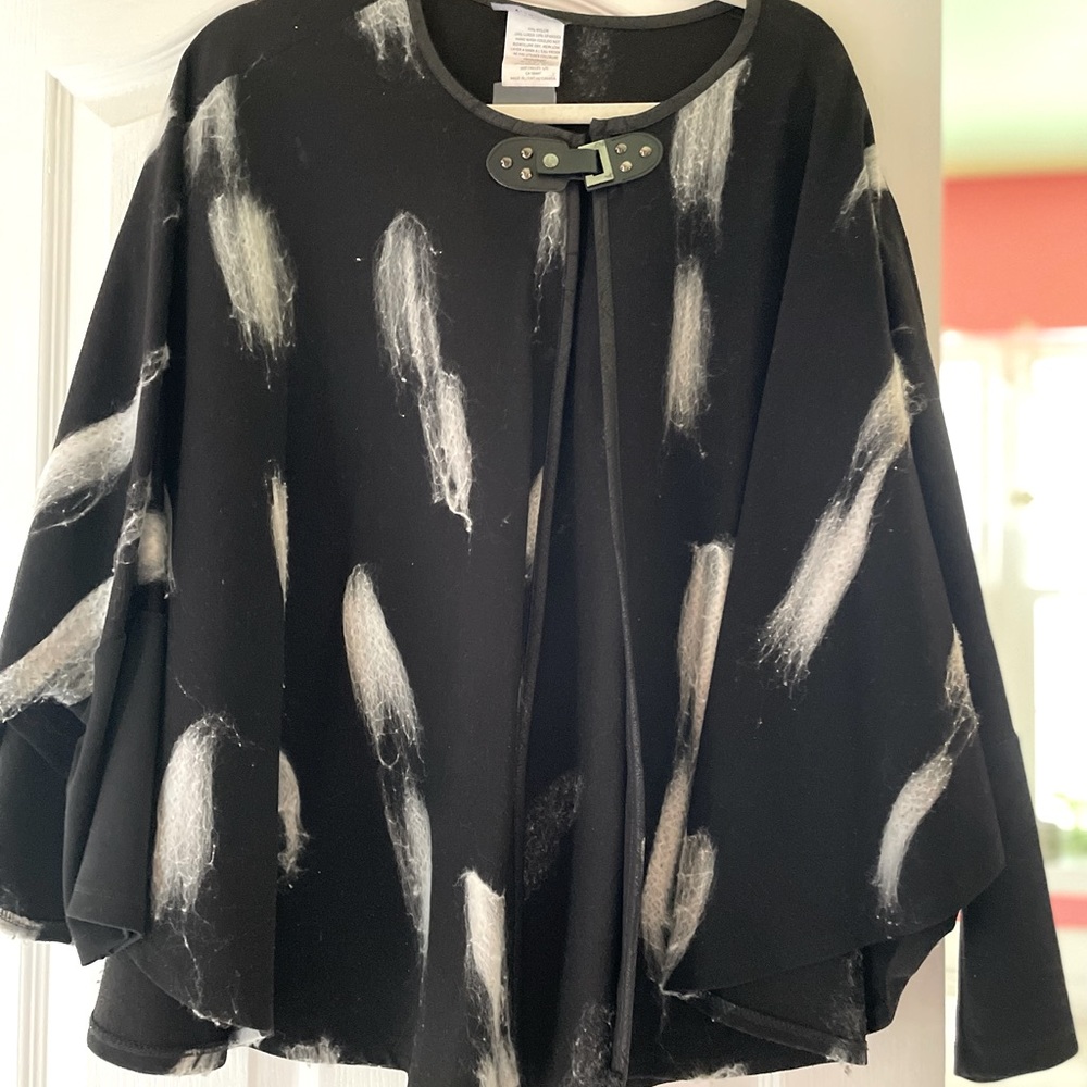 Stunning black sweater cape embellished flares white soft wool.Leather clasps